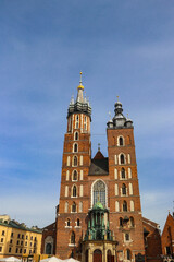 Obraz premium St. Mary's Basilica on Main Market Square in Krakow, Poland. UNESCO World Heritage Site