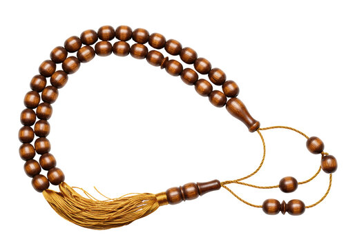 Isolated Islamic prayer beads, traditional brown rosary with tassel, spiritual faith object