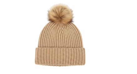 A cozy knitted beanie with a fluffy pom pom detail isolated on white background