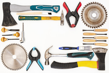 Flat lay of new and used hand tools on white background. Large collection of various tools and bits arranged on white.