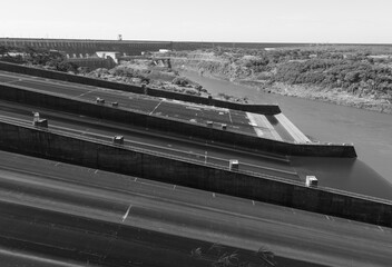 Fototapeta premium Black and white landscape comprising part of the Itaipu Power Plant spillway on the Paraguayan side along the Parana River