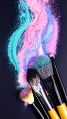 Makeup brushes in vibrant powder swirls