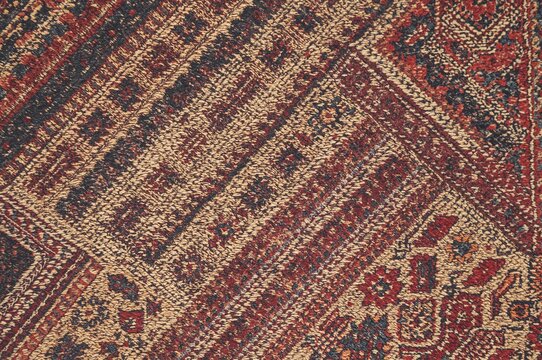 Design concept featuring a classic combined embroidery pattern with vintage-style illustration for website UI and interior decor, showcasing a carpet background.