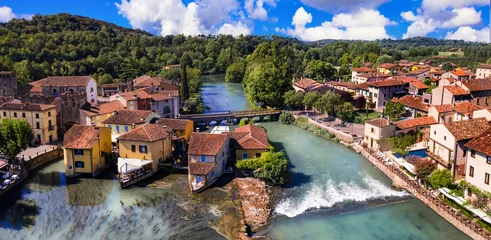 Fototapete Cappuccino Borghetto sul Mincio - one of the most beautiful medieval villages of Italy. colorful houses located in the middle river and waterfalls. Verona province, near Garda Lake  © Freesurf