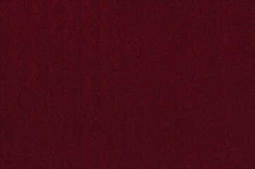 Fototapeta premium Crimson fabric couch with textile backdrop