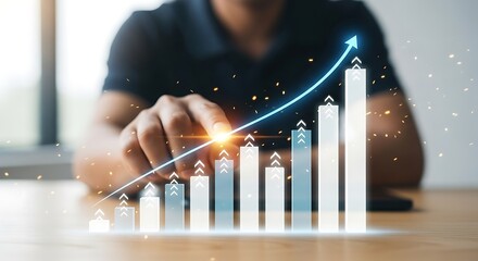 Businessman pointing at a glowing upward trending bar chart with an arrow, symbolizing financial growth and success