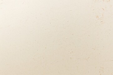 Close-up of vintage cream cardboard with grunge texture