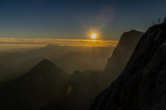 Alps mountains scenic landscape in summer. Austrian Alps scenery trekking path among the high mountain peaks in summer. Green mountain valleys with rocky peaks and lake in the Alps in Austria