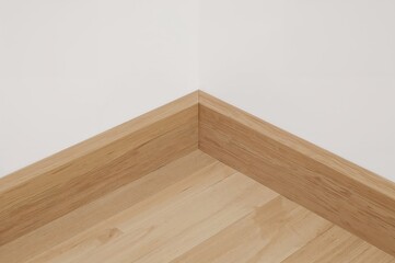 Cable cover outer corners for skirting board isolated on plain background
