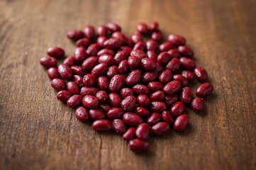 Dark Red Beans Displayed on a Rustic Wood Surface