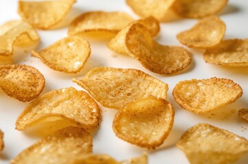 Potato chips scattered all over the background