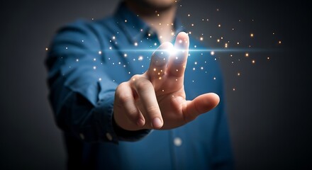 A person's hand touching a bright light with sparkling particles in a dark environment setting scene