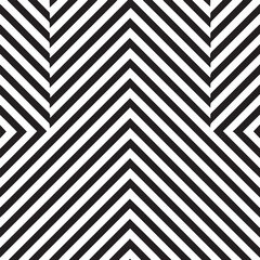 Abstract geometric pattern of sharp black and white chevron stripes creating a dynamic optical illusion of depth and movement
