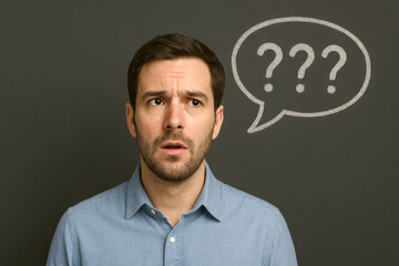 A man with a perplexed expression stands against a dark background. Above his head, a speech bubble contains three question marks.AI generated.