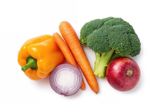 Assortment of raw veggies including bell pepper, carrot, and broccoli on a white surface
