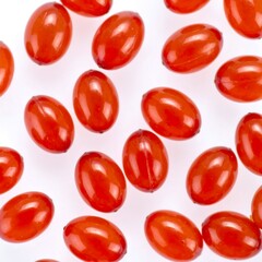 Red oval capsules on white background