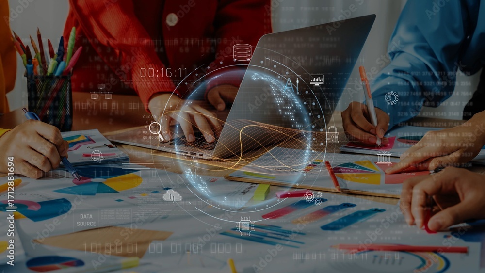 Poster a dynamic business meeting scene featuring a group working together with a laptop and colorful chart