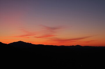 Obraz premium Peaceful Evening Outline Against Vibrant Hills