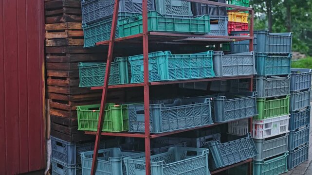 Empty Plastic and Wooden Food Vegetables Crates Stacked Behind Grocery Store Market Stand during Global Food Supply Crisis