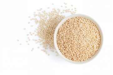 Uncooked buckwheat served in a dish against a white backdrop. Nutritious cereal grains and porridge for a wholesome diet. Blank area for text.