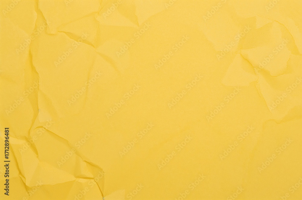 Poster background texture of crumpled yellow paper with ample copy space