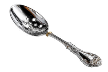 Ornate silver slotted spoon with gold accent for serving olives and other delicacies at a formal dinner on transparent background