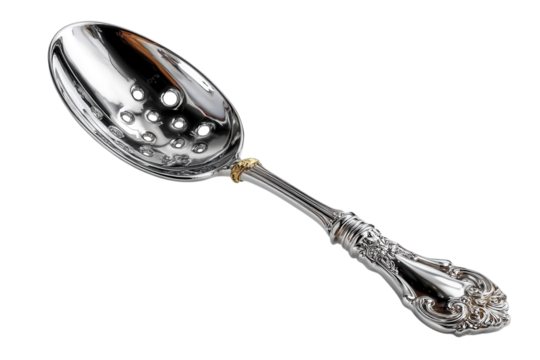 Ornate silver slotted spoon with gold accent for serving olives and other delicacies at a formal dinner on transparent background