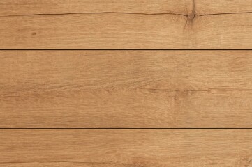 Light brown wooden plank showing natural grain texture, suitable for backgrounds or surfaces