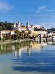 Sightseeing tour of the famous city of Passau. View across the Danube to the passenger harbour, the old town with the town hall and Passau Cathedral (Stephen's Cathedral).