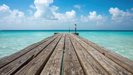 Timber jetty reaching out into the sea during summer