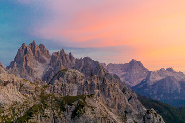 Obraz premium Dolomites mountains, Alpi Dolomiti beautiful scenic landscape in summer. Italian Alps mountain summits and rocky tower peaks above green valley alpine scene near Cortina'd'Amprezzo