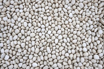 Background of white pebble stones symbolizing peace and meditation.
