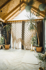 rustic greenhouse living room with tropical foliage for concepts of comfort  serenity and eco-friendly interior