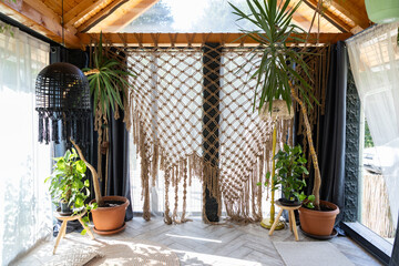 rustic greenhouse living room with tropical foliage for concepts of comfort  serenity and eco-friendly interior