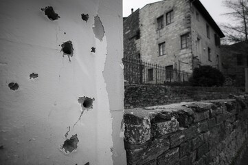 Bullet holes visible in urban area