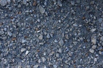 Grey Basalt Gravel for Fish Tanks, Coarse and Fine Granules, Decorative Pebbles, Scattered Sand Grit Texture, Small Stones on a Plain Background, Top Perspective