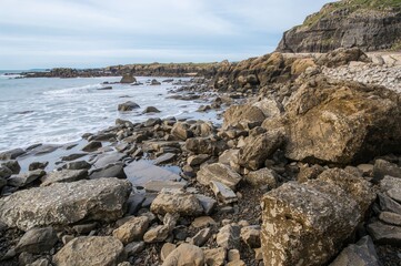 Stones Along the Coastal Edge During Receding Water