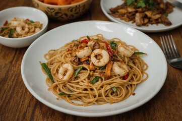 Home-cooked squid stir-fried noodles served on a dish