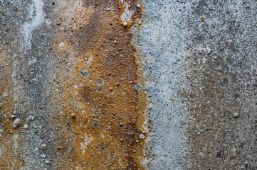 Pipeline surface with corrosion and scale deposits. Monitoring water purification process. Background texture featuring water, metal, and natural elements.