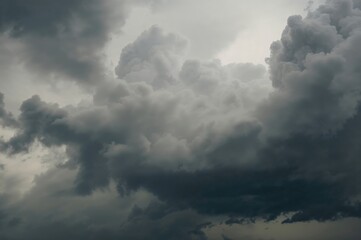 Dark storm clouds gathering in a turbulent sky with a soft-focus backdrop