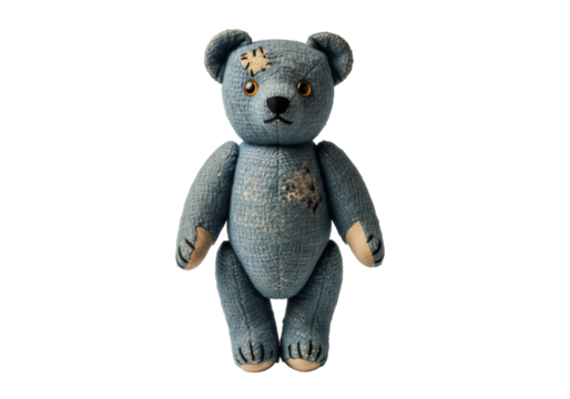 Antique, well-worn indigo wool teddy bear with amber glass eyes, standing upright, isolated on a transparent background with copy space, studio shot. Concept of cherished heirloom and quiet
