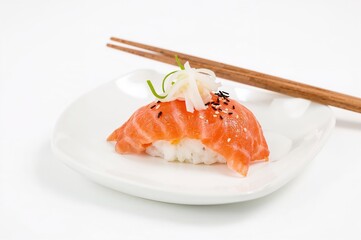 Assortment of sushi rolls served with chopsticks on a plain white dish