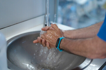 Person washing hands for hygiene and cleanliness