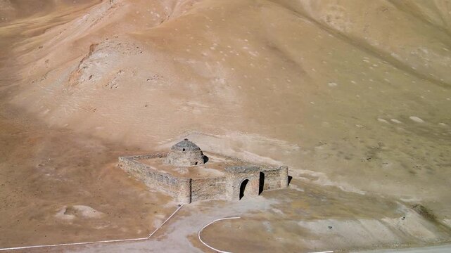 Aerial drone view of the ancient Tash Rabat caravanserai, built in the 15th century. Located in the mountains of the Tien Shan at an altitude of over 3500 m above sea level.
