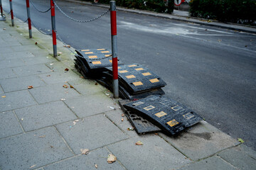 Broken speed bumps on roadside