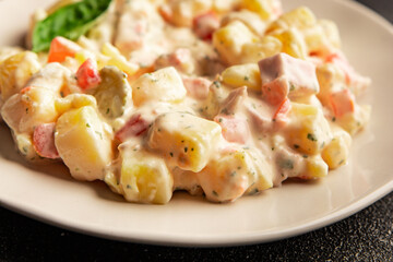 Potato salad ham, potato, tomato, carrot, mayonnaise tasty snack fresh delicious gourmet food background on the table rustic top view copy space