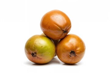 Four fresh organic sapodilla fruits stacked, isolated on a white background with clipping path