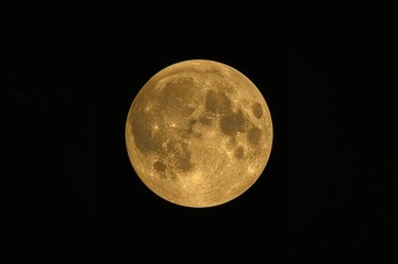 Fototapeta premium A radiant moon illuminating the dark sky, showcasing a mix of craters and smooth plains in a rich golden hue, with intricate shadows and highlights enhancing its texture.