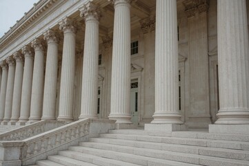 Obraz premium Detailed view of stone pillars and staircase in classical architecture