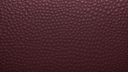 Pebble-patterned maroon leather texture perfect for sophisticated design concepts